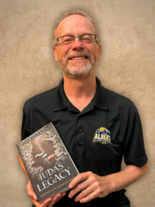 Bill Leesman holding The Judas Legacy book